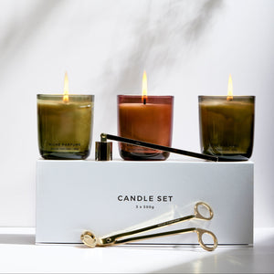 Set of three candles in glass containers with a white box labeled 'Candle Set' on a light background.